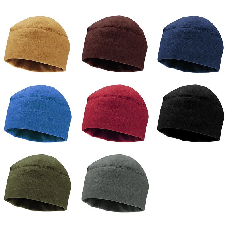Collection of seven fleece beanie hats in various colors including tan, brown, navy, blue, red, black, olive, and gray