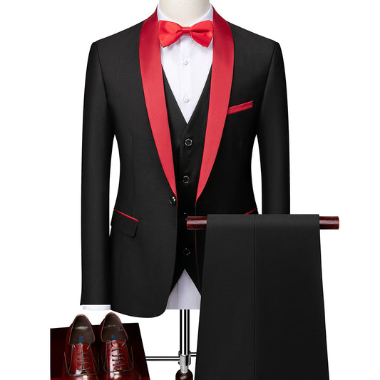 black tuxedo with red satin lapel, red bow tie, vest, black pants, and brown dress shoes on mannequin