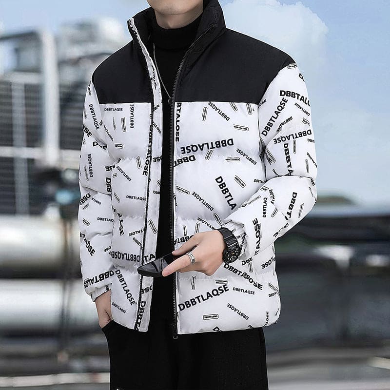 Man wearing black and white padded jacket with DBBTLAOSE print, urban background
