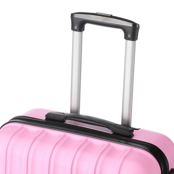 Pink hard-shell suitcase with black handle and silver telescopic trolley handle against white background