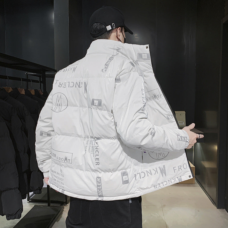 Man wearing white Moncler logo printed puffer jacket and black cap in modern clothing store