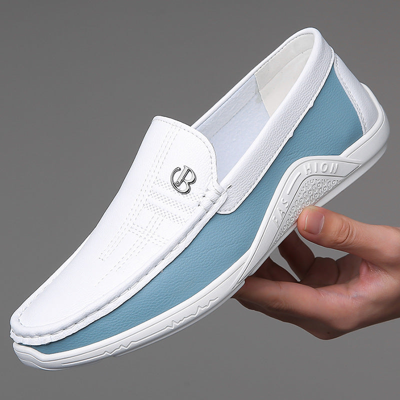 White and light blue men's casual slip-on shoe with rubber sole held against gray background
