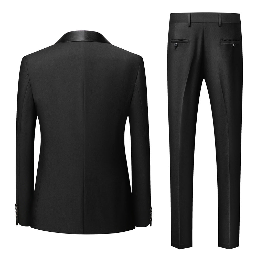 Back view of black formal men's suit jacket and matching trousers with satin details