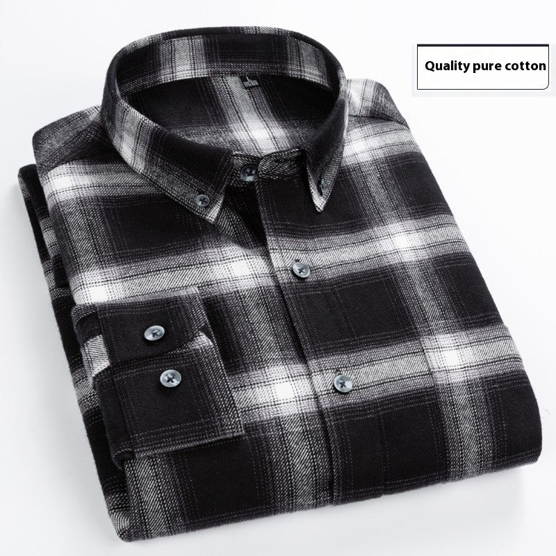 Folded black and white plaid cotton shirt with button-down collar on white background
