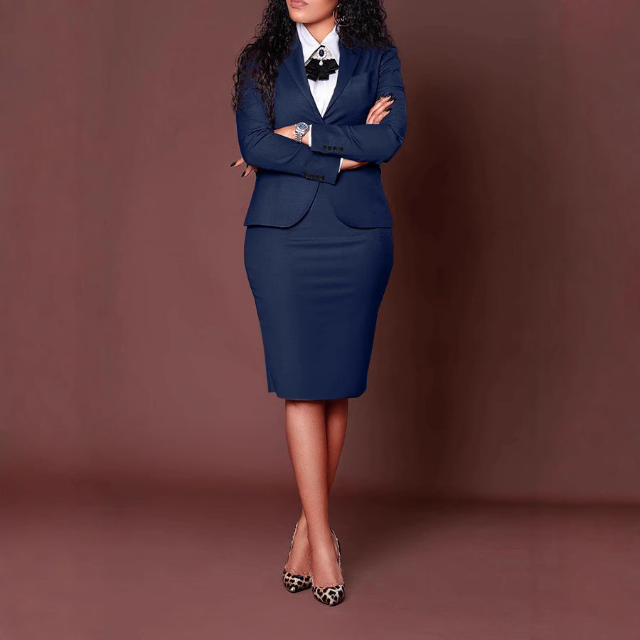 Confident woman in navy blue business suit with pencil skirt and leopard print heels on brown background