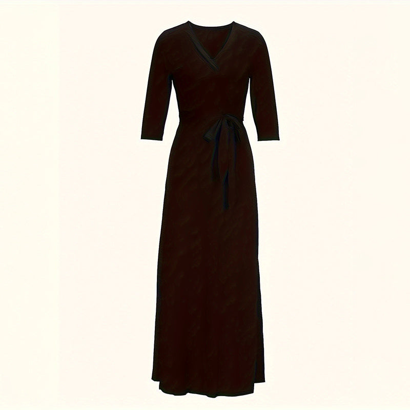 Elegant black wrap dress with three-quarter sleeves and waist tie detail on white background