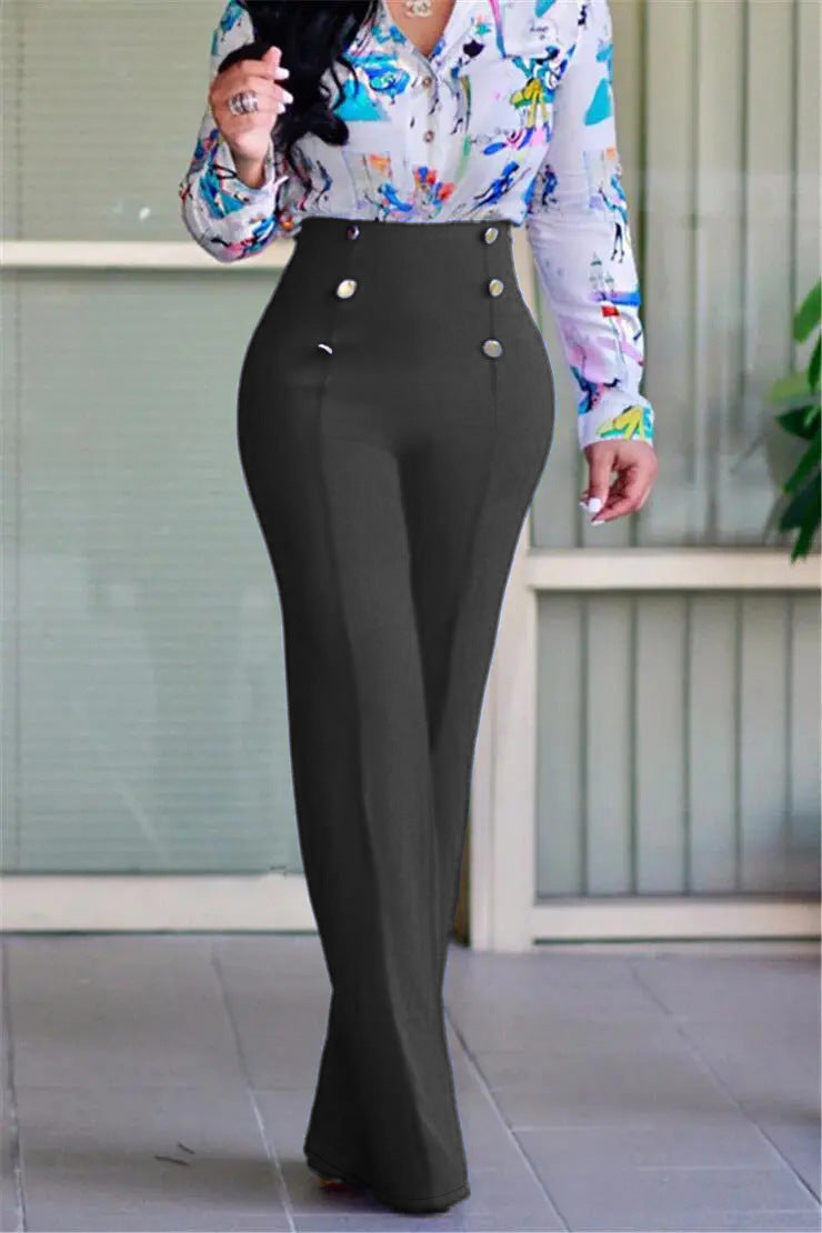 Woman wearing high-waisted black wide-leg pants with button details and floral blouse