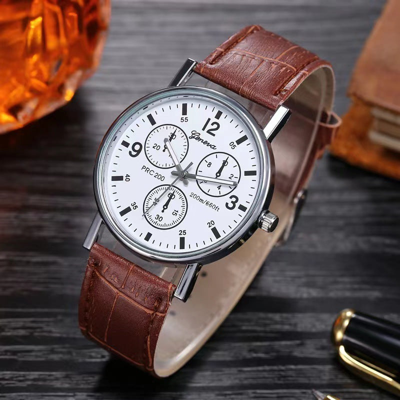 Geneva men's wristwatch with white dial, chronograph features, and brown leather strap on dark wooden surface