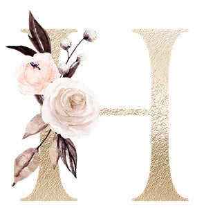 Gold textured letter H decorated with soft pink and white flowers and brown and green leaves