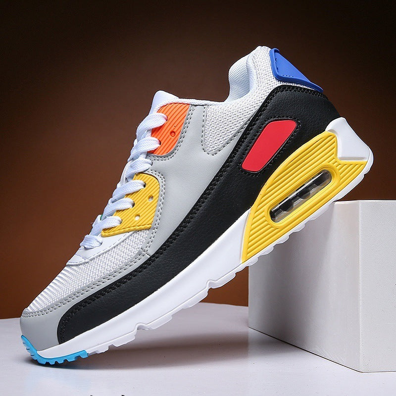 Modern multicolor athletic sneaker with white mesh, black overlay, yellow, red, orange, and blue accents