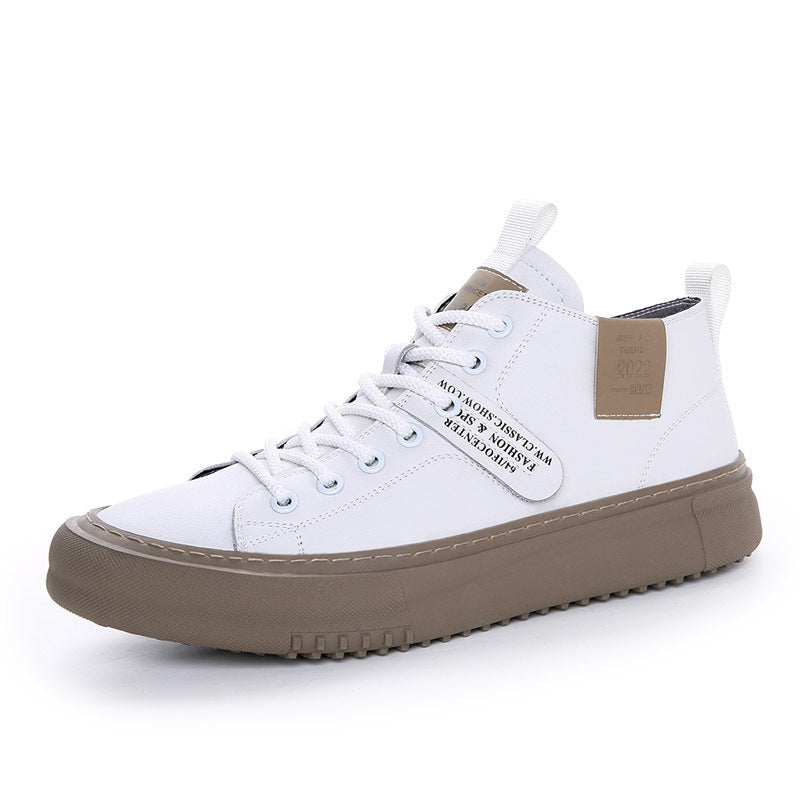 White high-top sneaker with brown rubber sole and stitched details, featuring a branded tag and white laces
