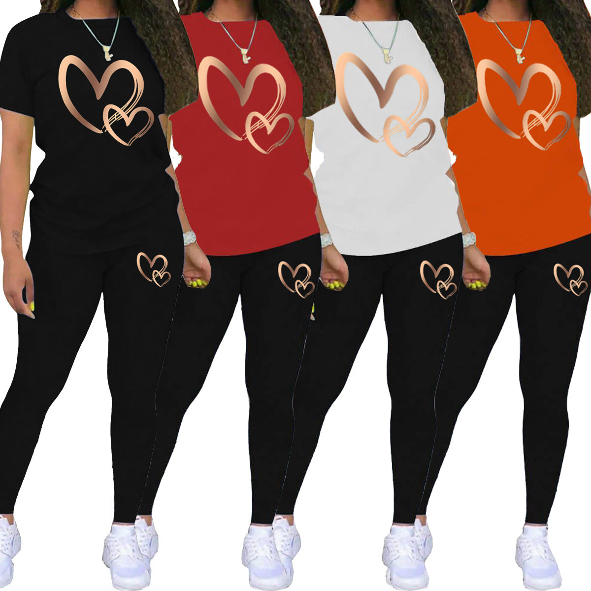 Women’s casual two-piece outfits with heart design in black, red, white, and orange tops and black leggings