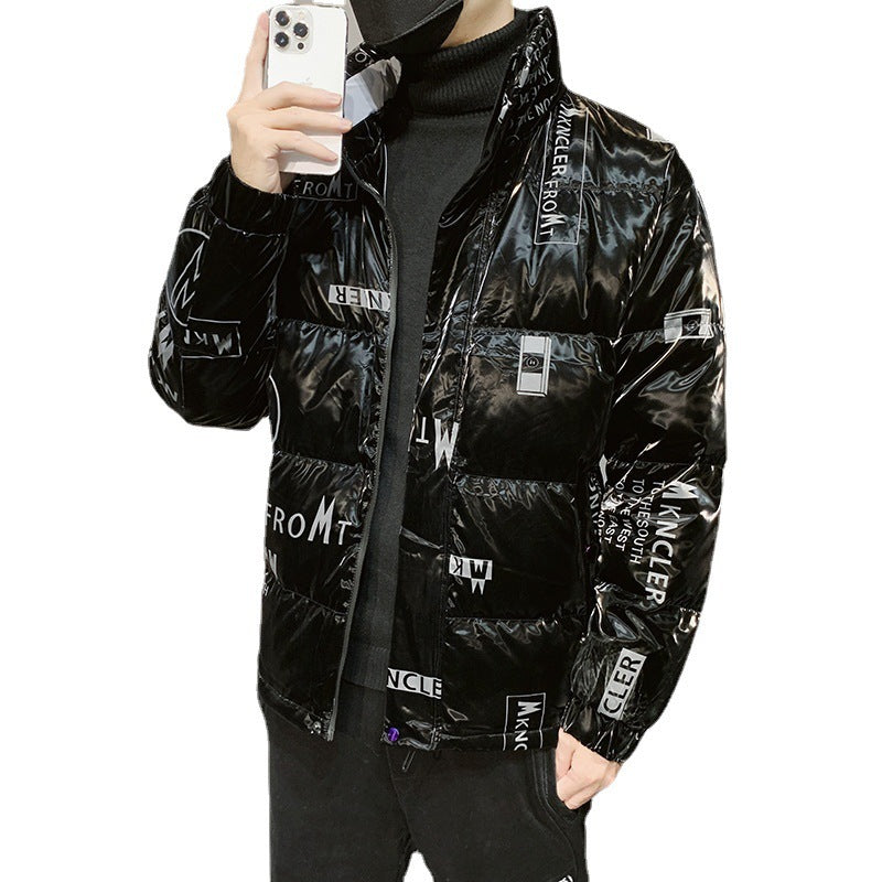 Man wearing glossy black puffer jacket with white text patterns taking selfie, black turtleneck and mask