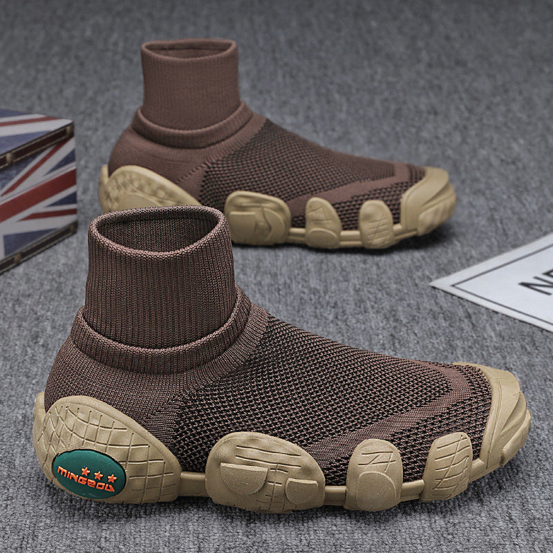 brown knit sock sneakers with beige textured outsole on grey carpet background