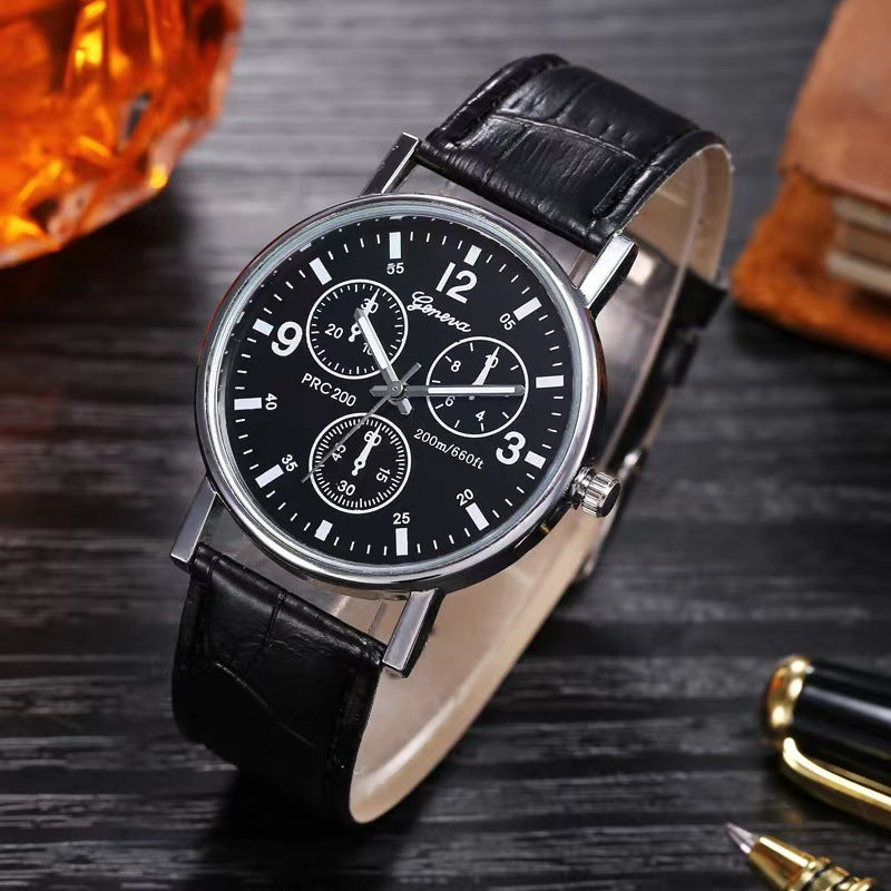 Geneva black dial wristwatch with silver case and black leather strap on wooden surface
