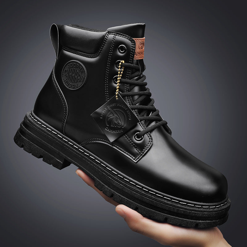 Hand holding black waterproof leather lace-up boot with rugged sole and branded tags