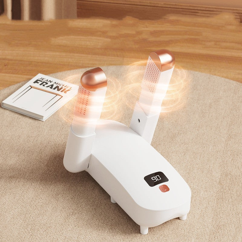 white air purifier with digital display on carpet near book on wooden floor