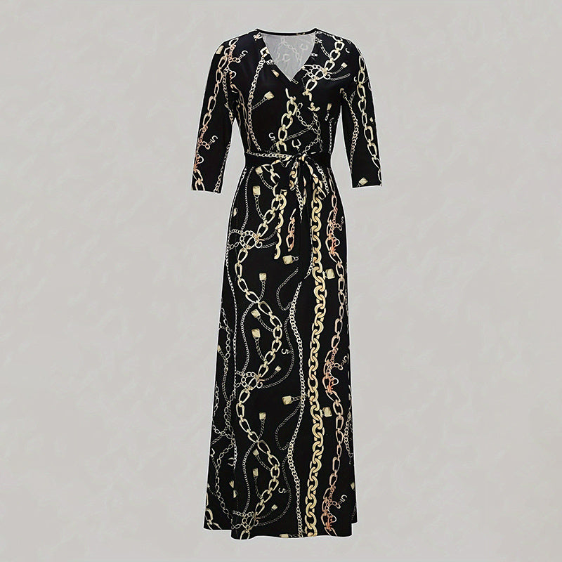 Black maxi wrap dress with 3/4 sleeves featuring gold and silver chain print pattern