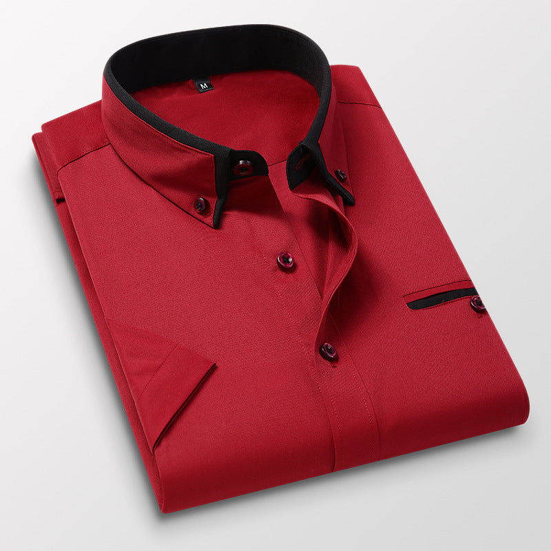 Folded red men's dress shirt with black collar trim and black-accented buttons on white background
