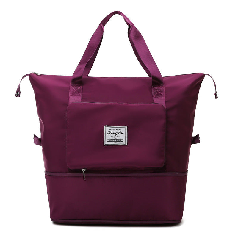Purple large tote bag with dual handles, front pocket, and zipper compartment on white background