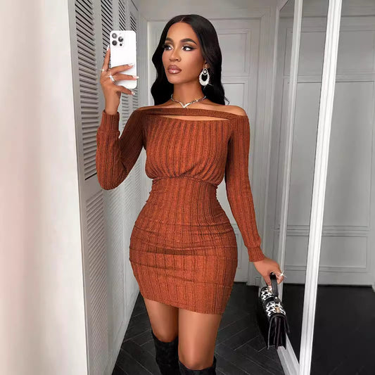 Woman taking selfie in brown ribbed knit off-shoulder mini dress with long sleeves and black boots