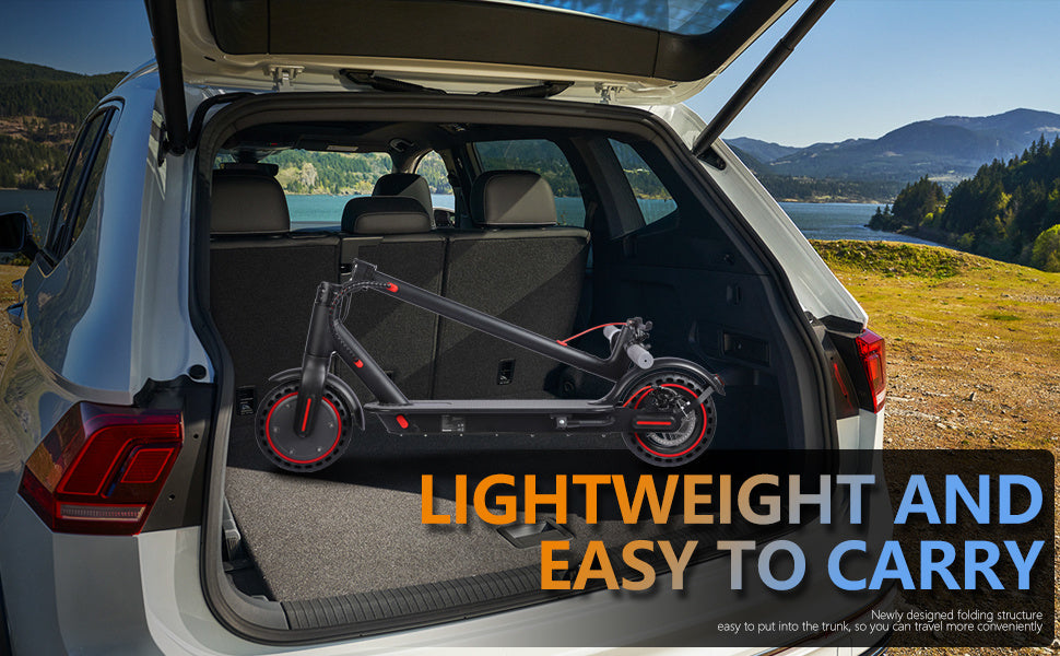 Folded electric scooter in white SUV trunk with scenic mountain lake background, lightweight and portable