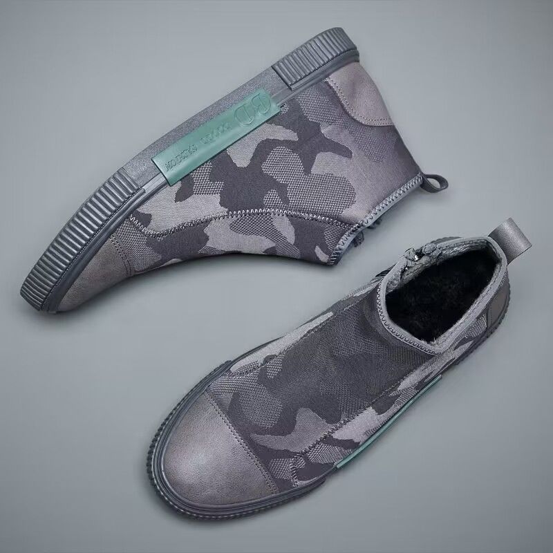 Gray camo high-top sneakers with zipper closure and rubber sole on gray background
