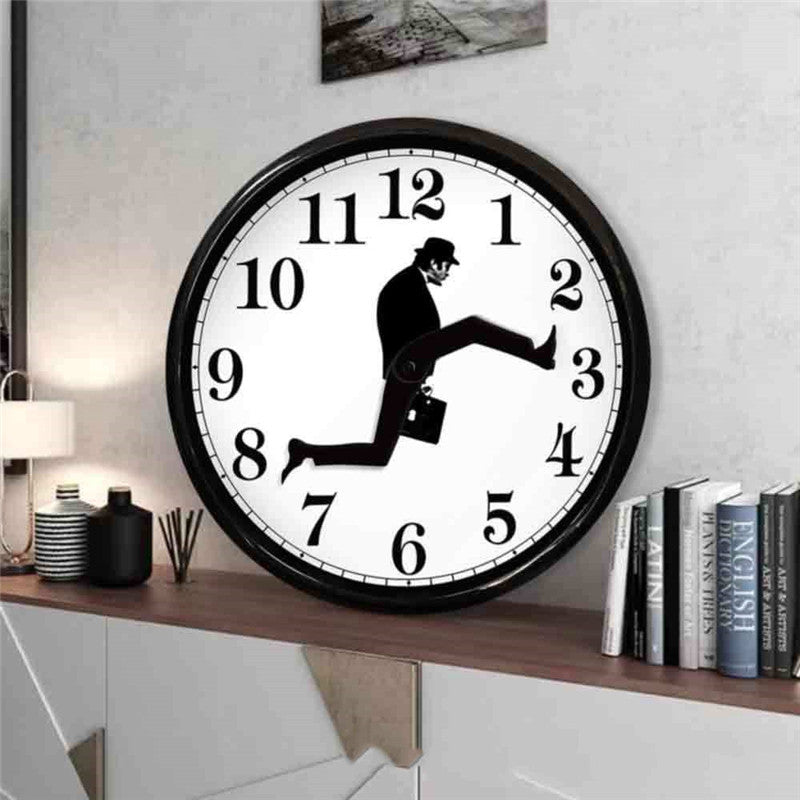 Modern wall clock with a black frame featuring a comedic business man silhouette in bowler hat carrying briefcase as clock hands
