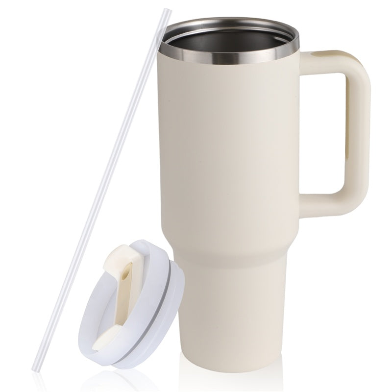 Cream insulated travel mug with handle, stainless steel interior, lid, and clear straw