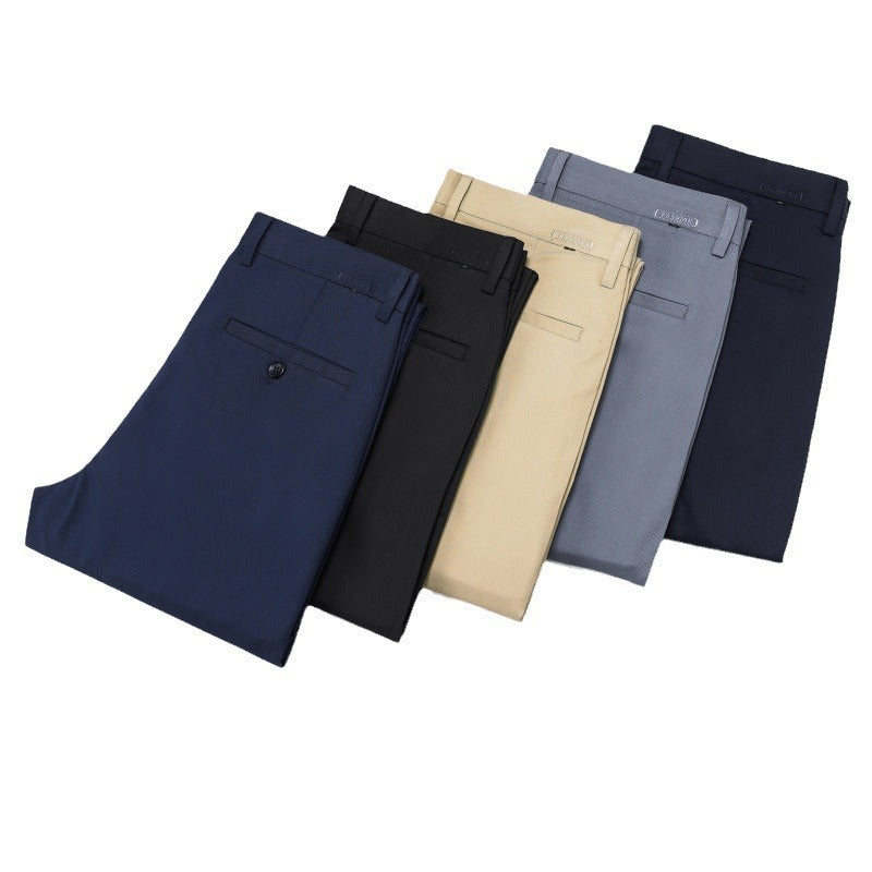 Five pairs of folded casual pants in navy, black, beige, gray, and dark blue colors on white background