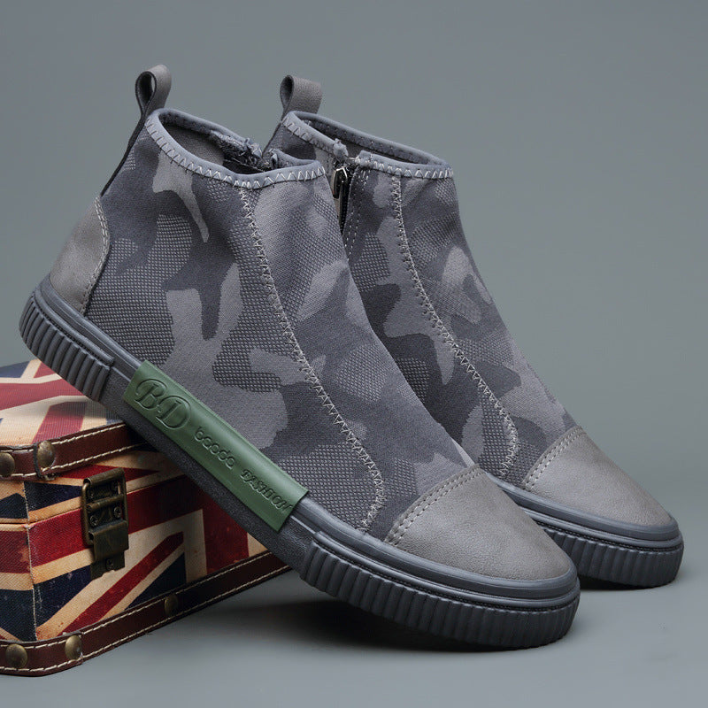 Gray camouflage high-top slip-on sneakers with green BD logo on side, displayed on Union Jack box