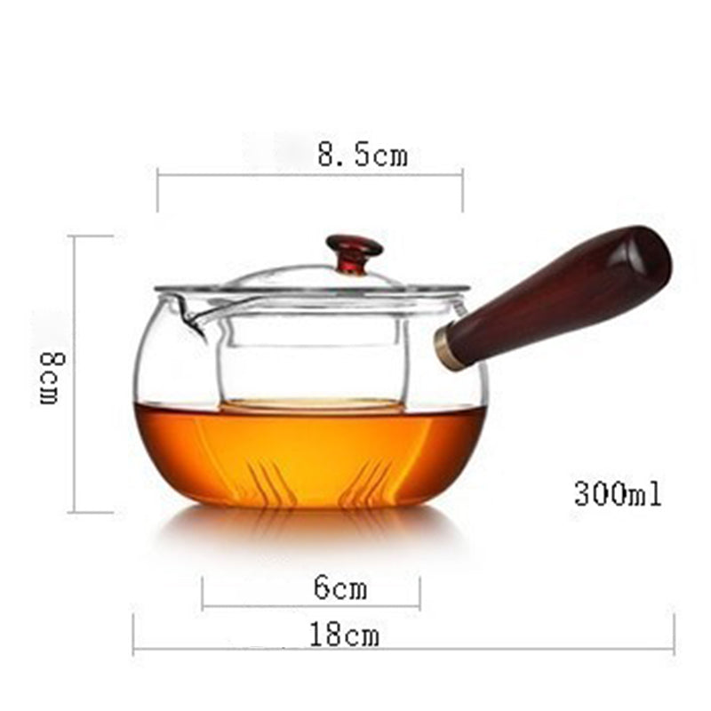300ml glass teapot with wooden handle and lid, dimensions 18x8.5x8 cm, filled with amber tea