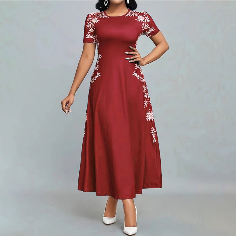 Woman wearing elegant red short sleeve maxi dress with white floral embroidery and white heels