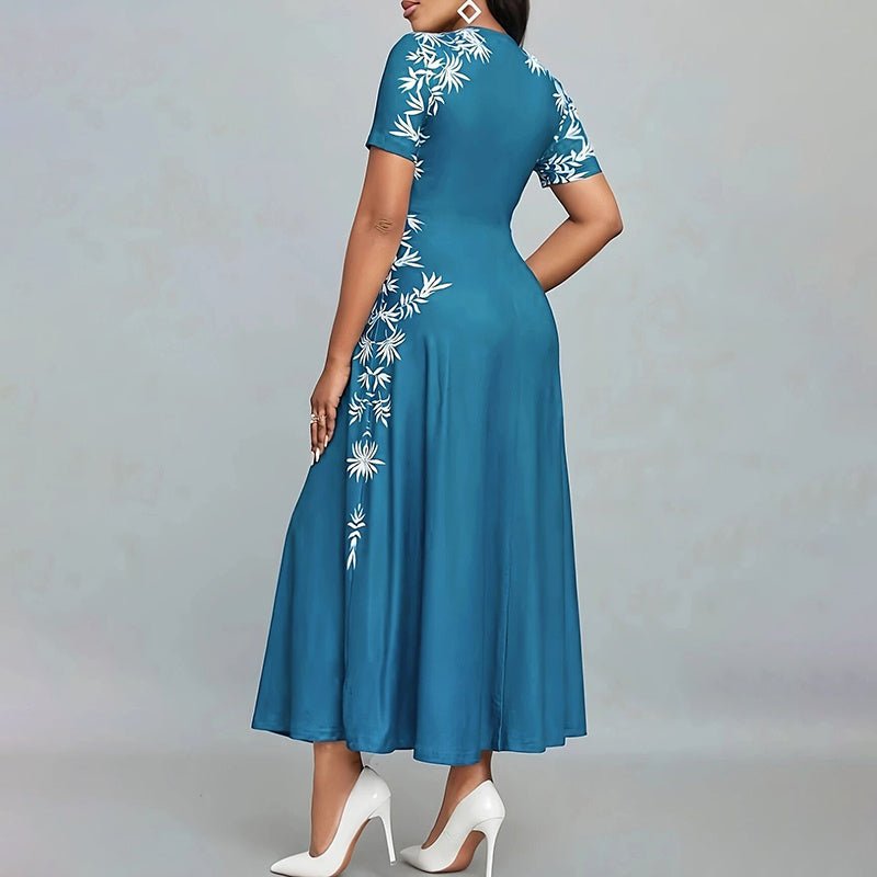 Woman wearing elegant blue short-sleeve maxi dress with white floral empire waist design