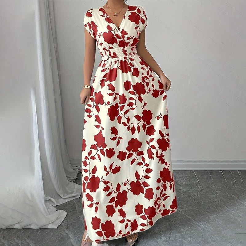woman wearing white wrap v-neck maxi dress with red floral print and elastic waist standing indoors