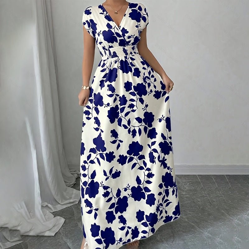 Woman wearing white wrap v-neck maxi dress with navy blue floral print and elastic waist